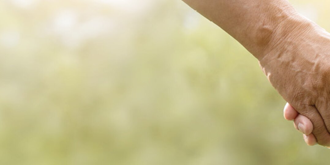 Hands hold each other as a community